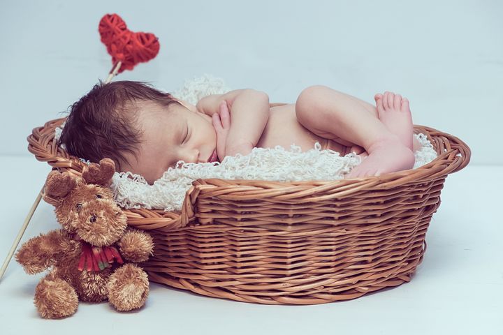 sleeping baby inside a basket